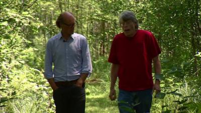 Will Gompertz and Stephen King walking through a wood