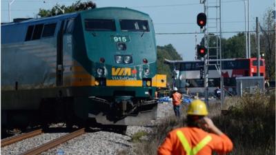 A damaged train and bus