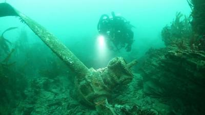 Diver with wreckage of Sunderland plane