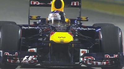 Sebastian Vettel salutes the crowd after his victory in Singapore