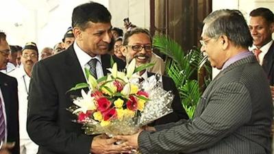 Ranghuram Rajan is handed flowers