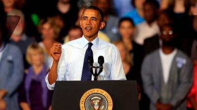 US President Barack Obama speaks to workers as he visits the Ford Kansas City Stamping Plant, Liberty, Missouri, on 20 September 2013