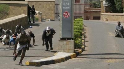 Gun battle outside the Westgate Mall, an upscale shopping mall in Nairobi, Kenya Saturday Sept. 21 2013