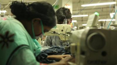 Woman working at sewing machine