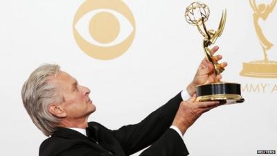 Michael Douglas poses with his 'Outstanding Lead Actor In A Miniseries Or A Movie' Emmy award, which he won for his role as Liberace in the movie 'Behind The Candelabra'