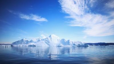 An iceberg floats through the water on July 20, 2013 in Ilulissat, Greenland