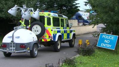 Police vehicle outside farm near Newport