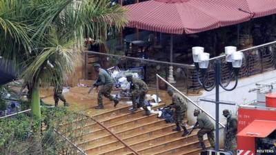 Kenyan defence forces taking position on the steps of the Westgate mall