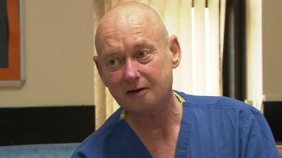 Jim Doyle in hospital scrubs