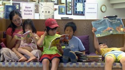 Asian American family at the library