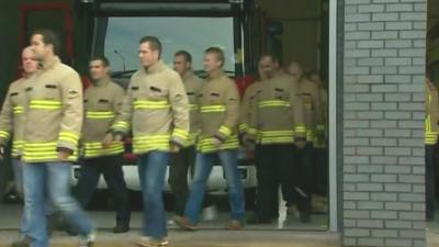 Fire crew walk out