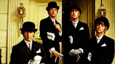 Photo of the Beatles posing as City financiers in 1964