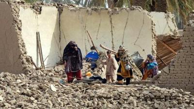 Awaran earthquake survivors on rubble