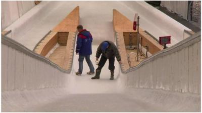 Men working on a ski jumping ramp