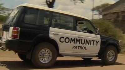 A 4x4 patrolling a neighbourhood. It is funded by local businesses and households.