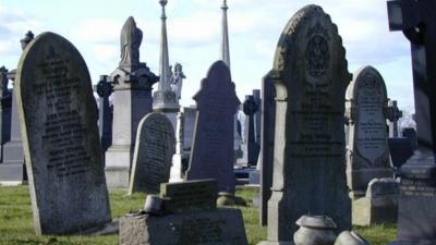 Headstones in a an unnamed cemetery.