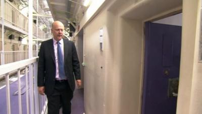 Chris Grayling visiting prison