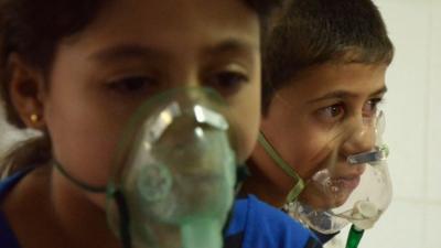 Children, affected by what activists say was a gas attack, breathe through oxygen masks in the Damascus suburb of Saqba, August 21, 2013