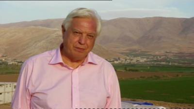 John Simpson at a refugee camp near Beirut.