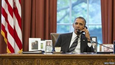 US President Barack Obama speaking by phone to President Hassan Rouhani of Iran (27 September)