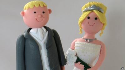 Bride and groom on a wedding cake