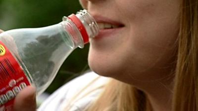 Girl drinking from a bottle