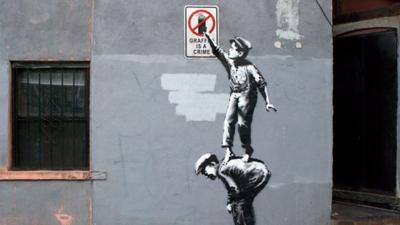 Spray art by Banksy which appeared in New York on 1 October 2013