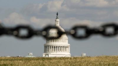 US Capitol behind a chain fence