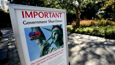 A notice explaining the Statue of Liberty is closed due to the US Government shutdown