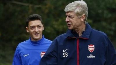 Arsene Wenger and Mesut Ozil