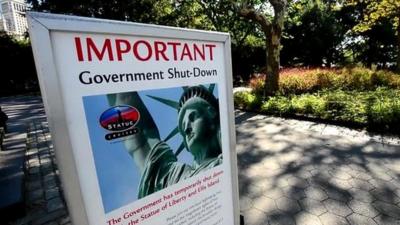 A notice explaining the Statue of Liberty is closed due to the US Government shutdown