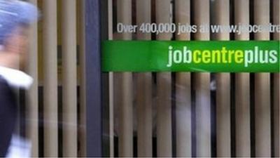 Person walks past a job centre