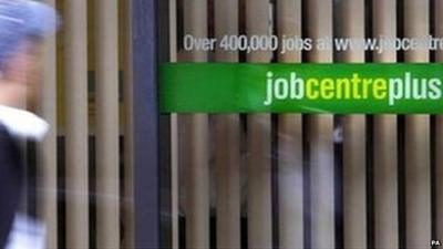 Person walks past a job centre