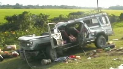 Damaged minibus after crash in Assam