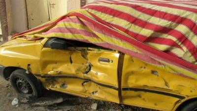 Car damaged in Baghdad explosion