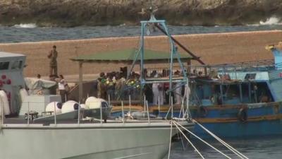 Emergency workers gathered at Lampedusa