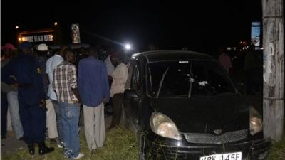 Crowds gather around the car in Mombassa