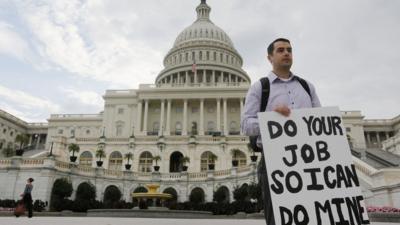 A federal employee protests at the shutdown