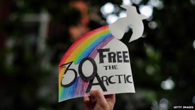 Protester holds sign at London Greenpeace protest