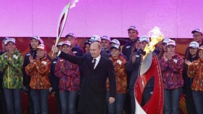 President Putin received the Olympic flame in Red Square and lit the cauldron