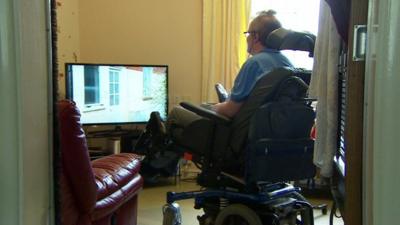 Multiple Sclerosis patient Richard Stapely watching television