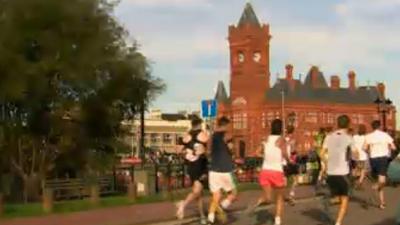 Runners near Cardiff Bay on half marathon