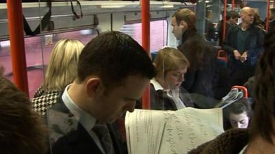 Commuters on packed train