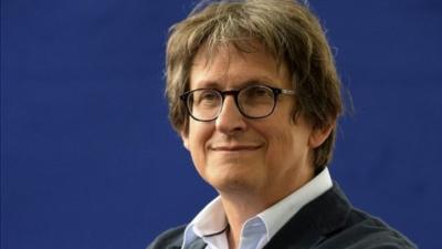 Guardian editor Alan Rusbridger poses for a photograph at the Edinburgh International Book Festival in Edinburgh, Scotland, Thursday, Aug. 22, 2013