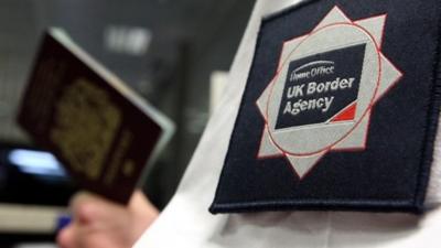 UK Border Agency officer at Passport Control