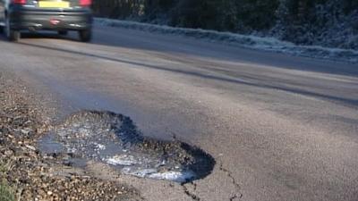 Road with pothole