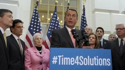 John Boehner surrounded by fellow House Republicans