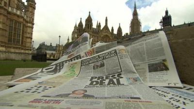 Newspapers with Westminster in background