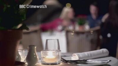 A still from a BBC Crimewatch reconstruction shows diners in a restaurant