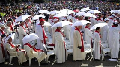 Devotees attend the beatification